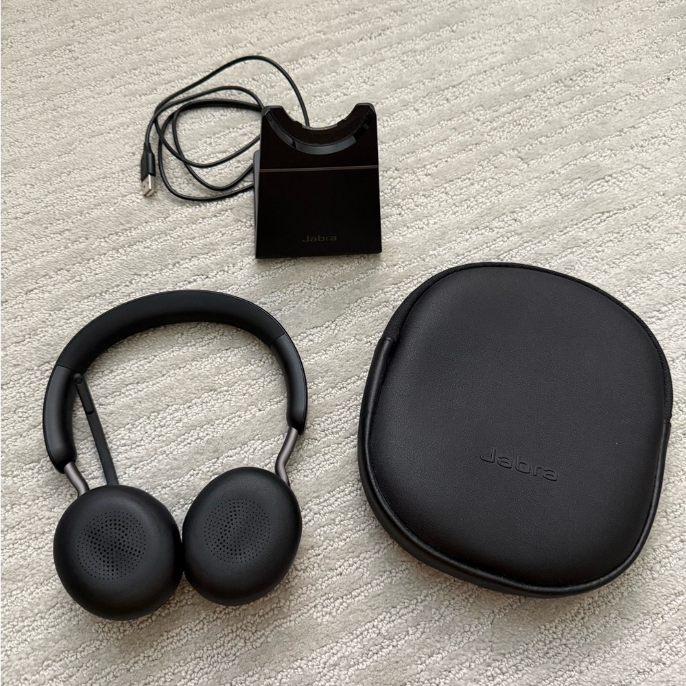 Jabra Evolve2 wireless headset and charging stand with case—great condition